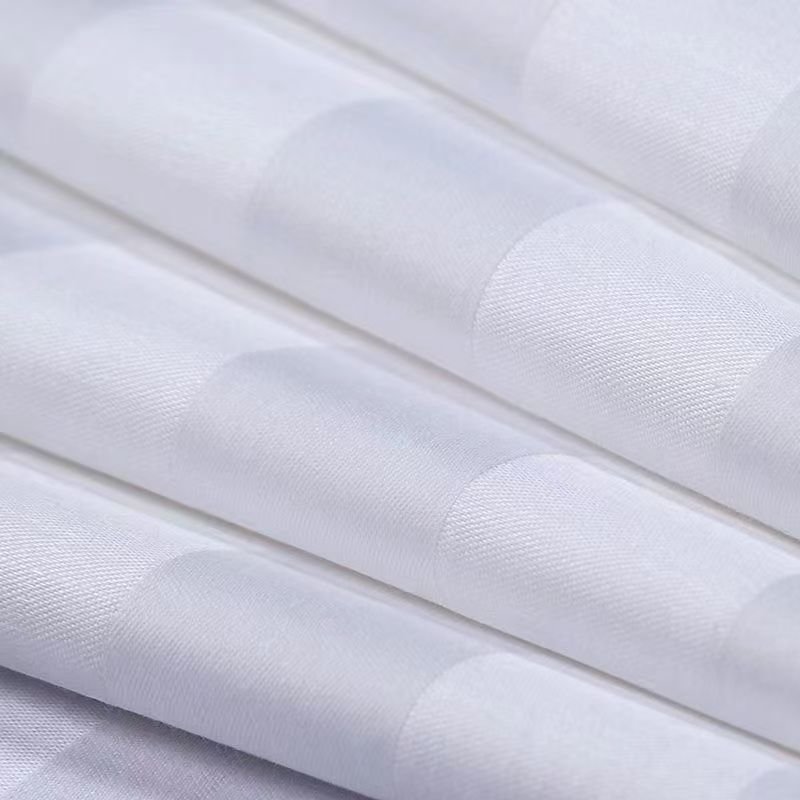 Close-up of white jacquard hospitality fabric